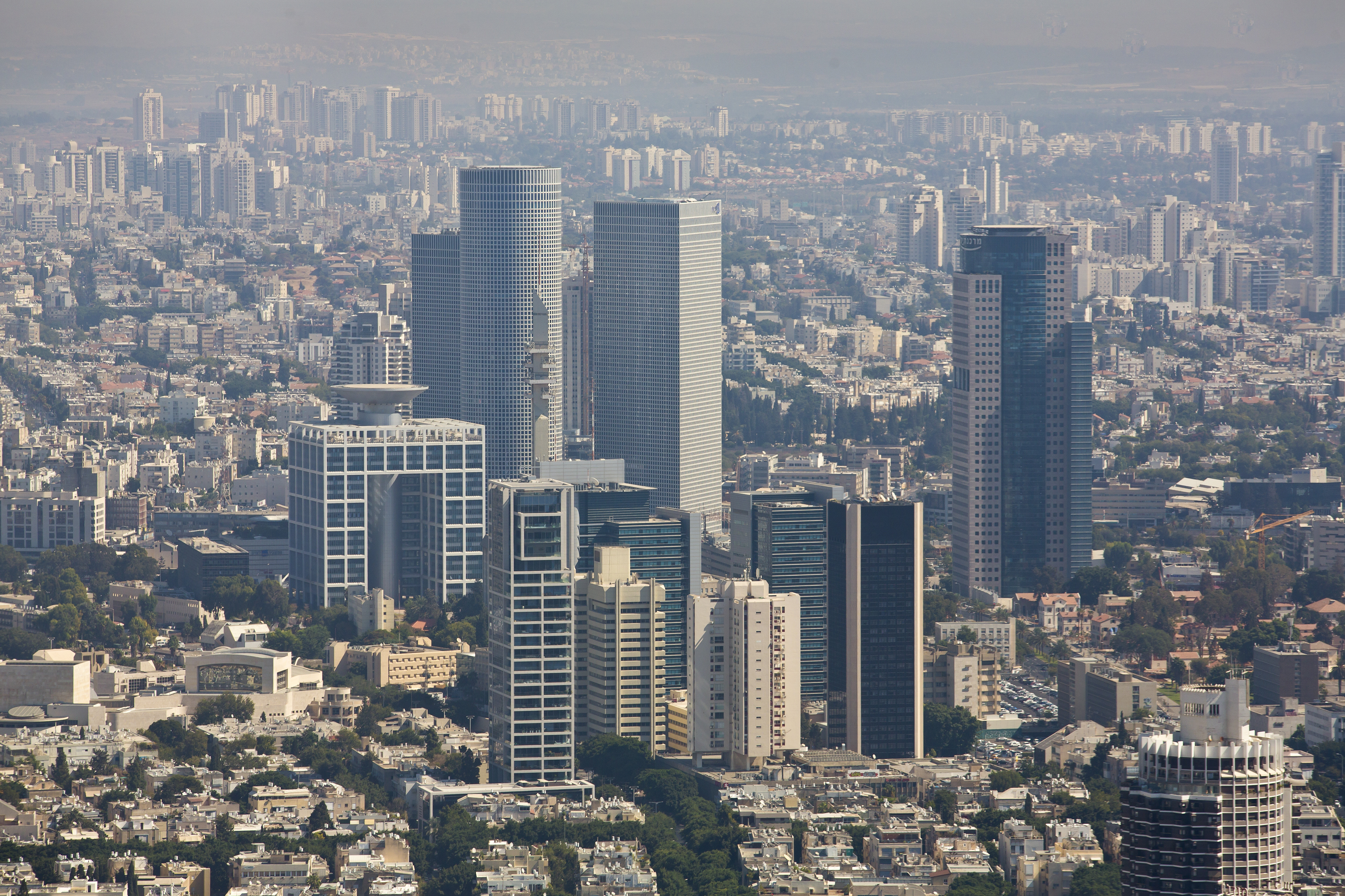 Aerial view of the Azrieli towers in Tel Aviv and the 'Kirya' containing the Tel-Aviv District government center and the major Israel Defense Forces base, Camp Rabin. November 10, 2013. 