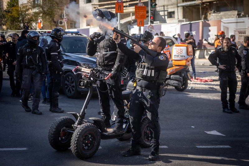 Ultra Orthodox Jewish men clash with police during a protest against the jailing of a Jewish seminary student who failed to comply with an army recruitment order, on Bar Ilan road, Jerusalem. December 18, 2025. 