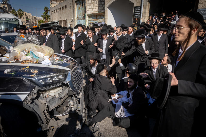 Ultra Orthodox Jewish men clash with police during a protest against the jailing of a Jewish seminary student who failed to comply with an army recruitment order, on Bar Ilan road, Jerusalem. December 18, 2025. 