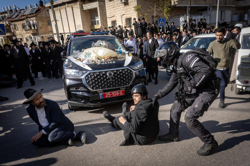 Ultra Orthodox Jewish men clash with police during a protest against the jailing of a Jewish seminary student who failed to comply with an army recruitment order, on Bar Ilan road, Jerusalem. December 18, 2025.