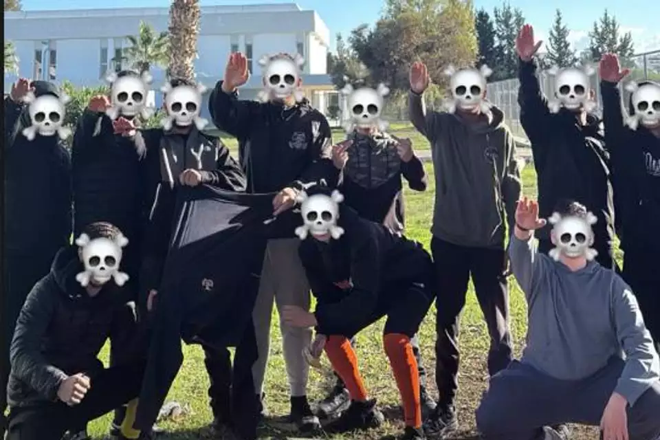 The students photographing themselves giving Nazi salutes.