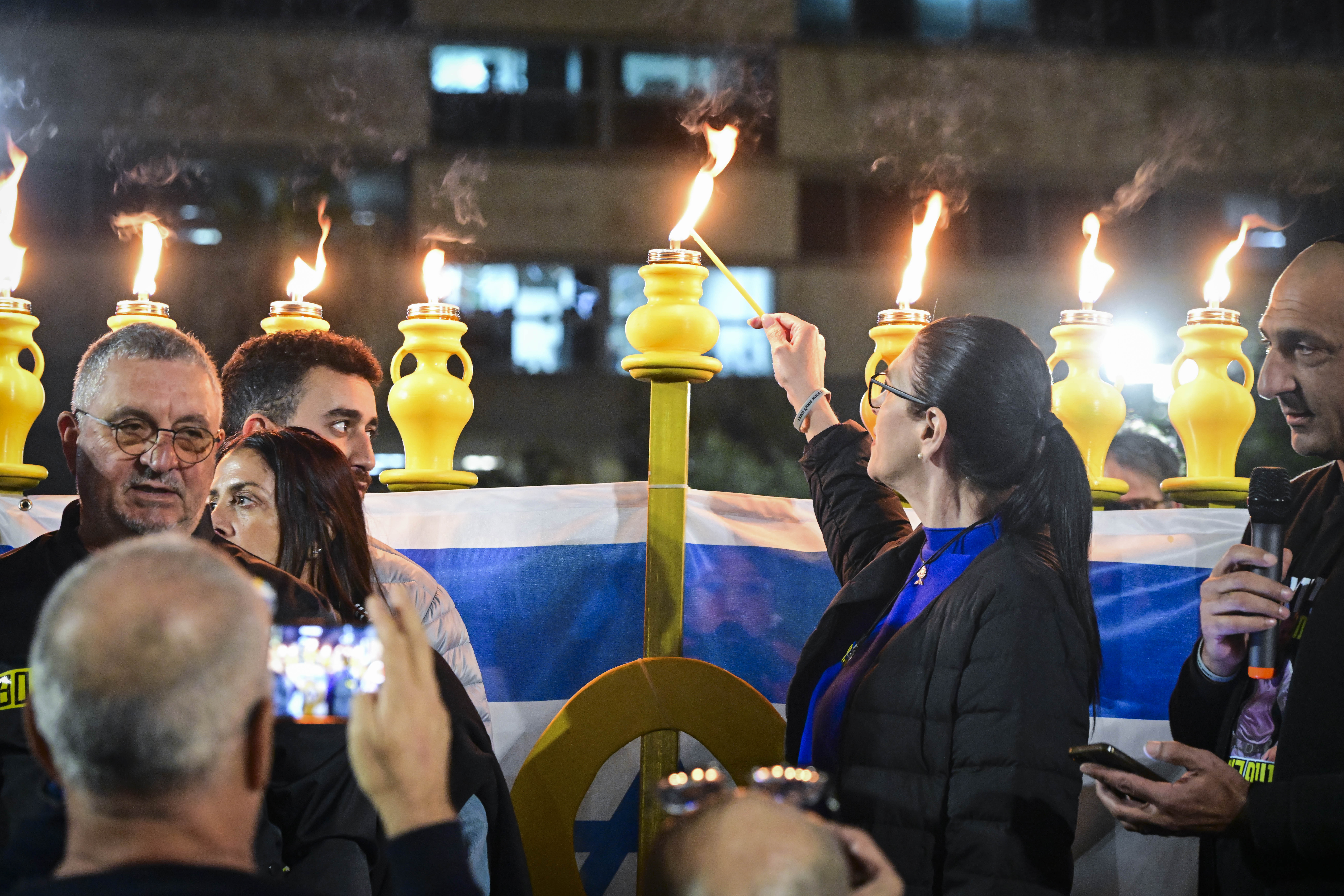 Ran Gvili's family and friends light Hanukkah candles at Hostages Square, December 21, 2025