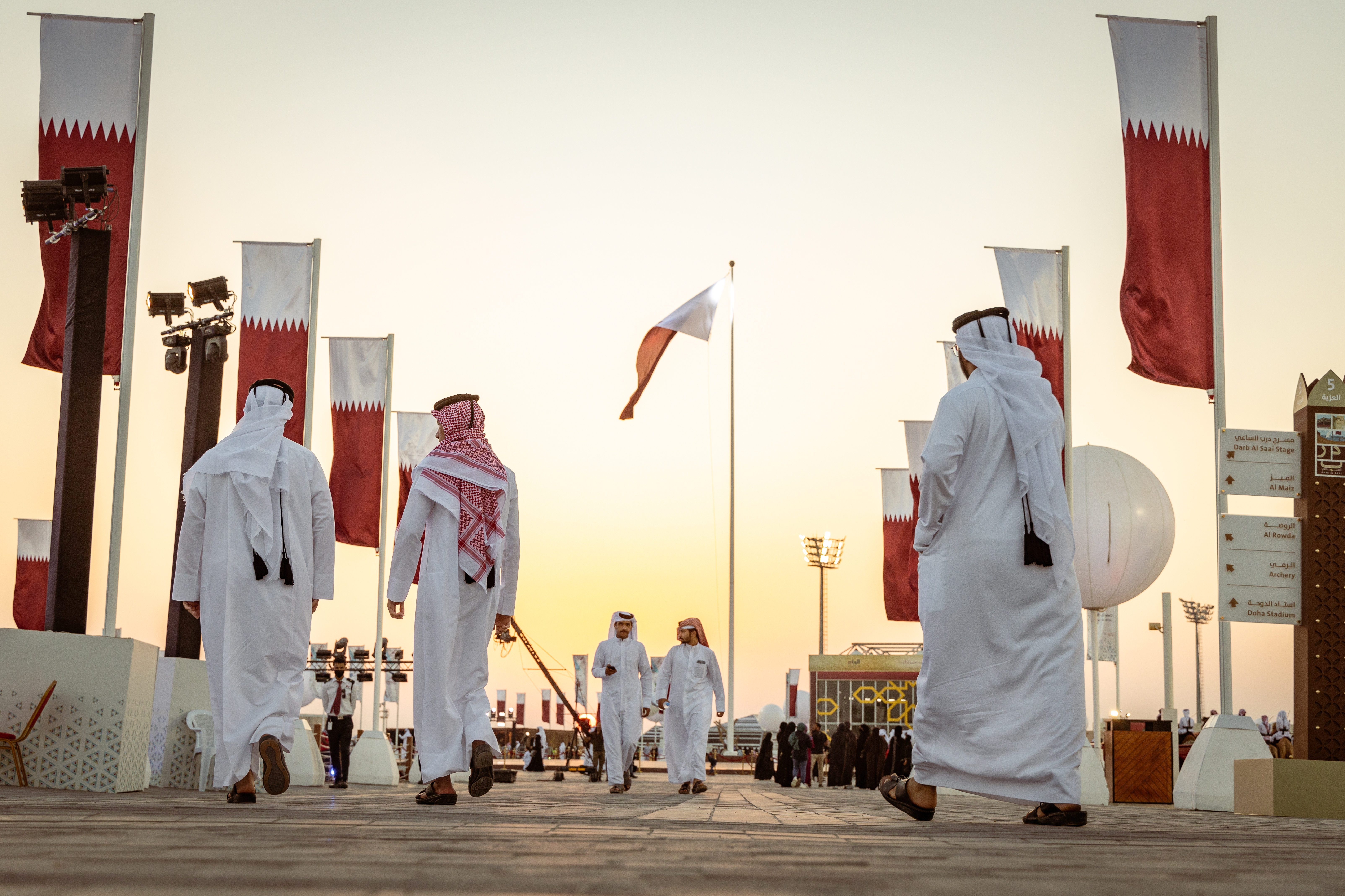 Doha, Qatar - December 2, 2022: The Qatari men walking at the Al Darab Saai at Umm Salal Mohamad in Doha, Qatar. During celebrate Qatar national day.