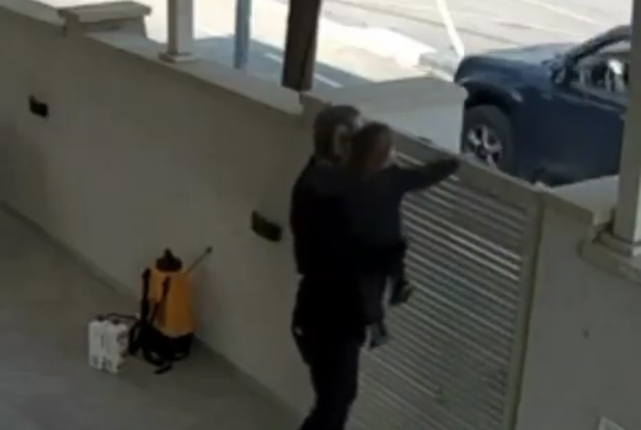 Grandfather and baby grandson escaping terrorist by seconds