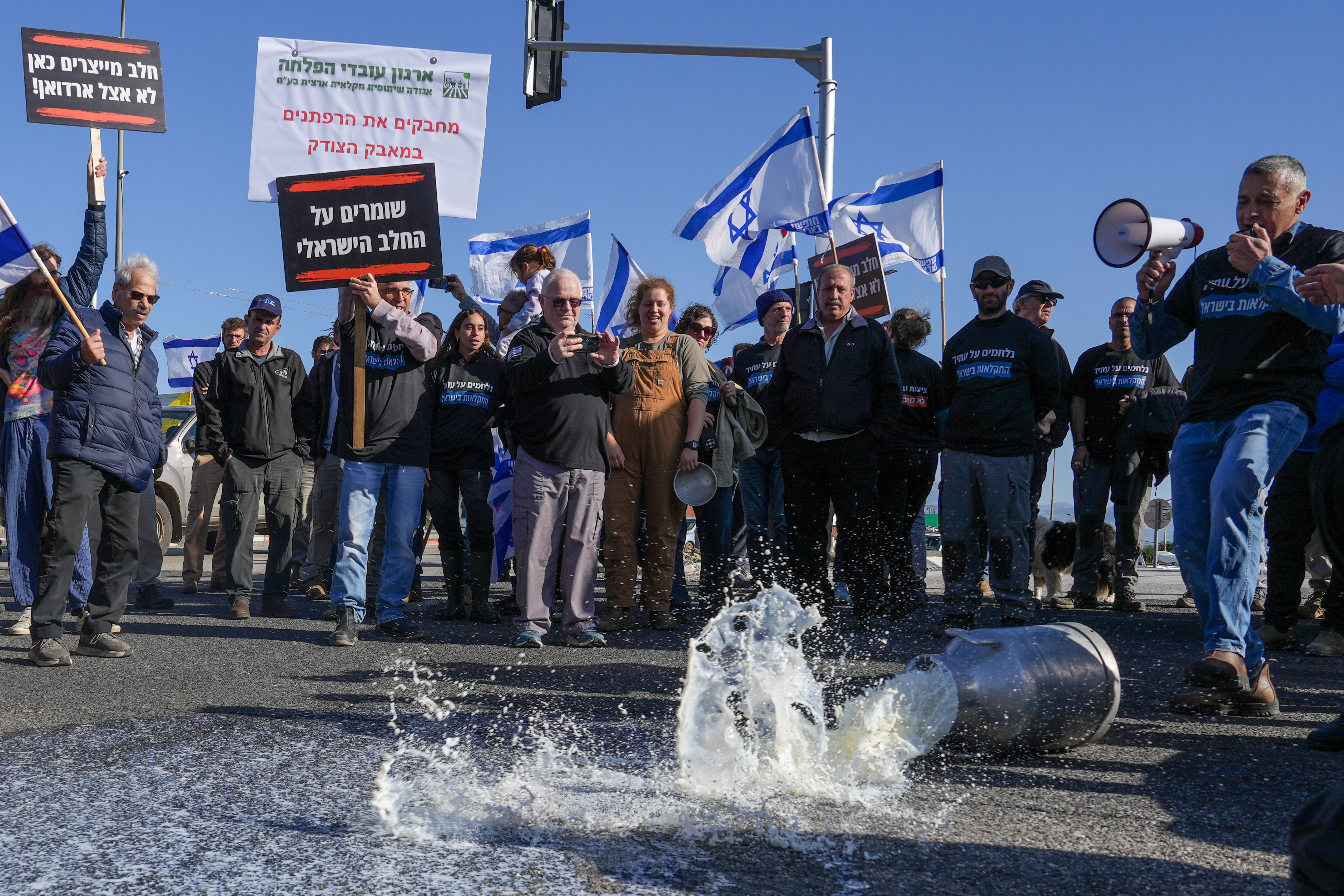 Dairy farmers and their supporters protest against the milk reform led by Finance Minister Bezalel Smotrich at the HaGoma Junction near the city of Kiryat Shmona, northern Israel, January 6, 2026.