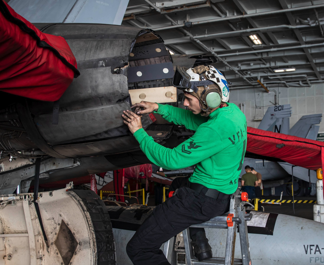 US navy soldier working on USS Abraham Lincoln