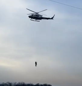 Heliocpter rescues man who fell through frozen lake