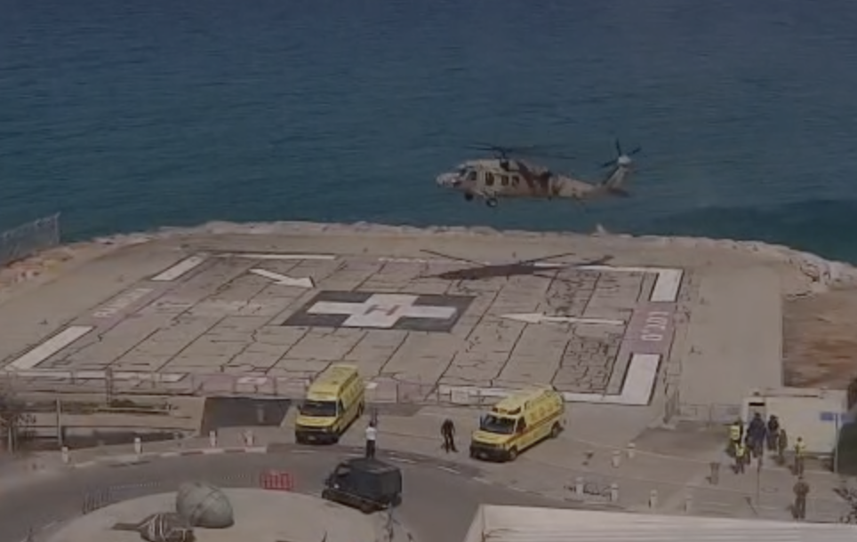 Helicopter transports 2 wounded soldiers