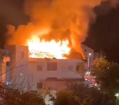 A house on fire from a rocket in Rishon Lezion