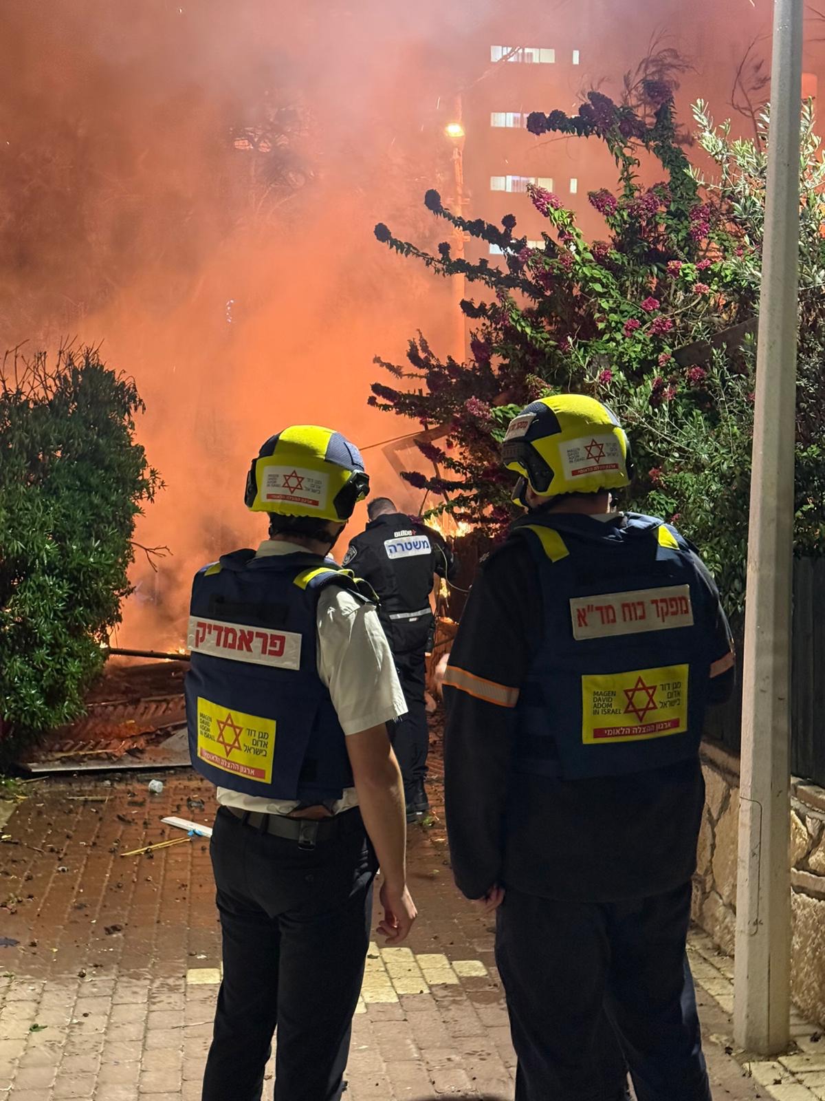 Rescue personnel at the scene of a fire in Nahariya during Operation Roaring Lion