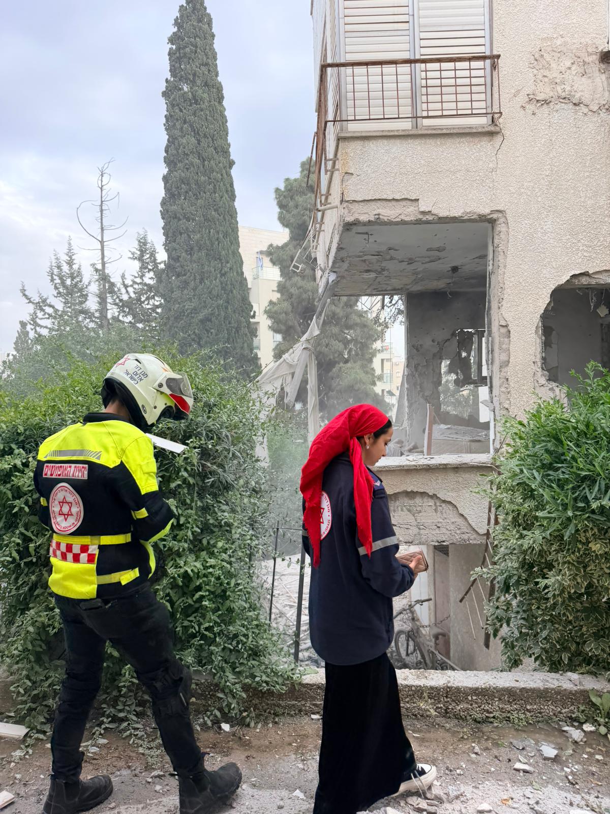 MDA personnel survey damage from iranian missile