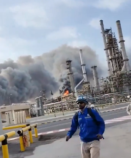 WORKERS EVACUATE AS SAUDI ARAMCO REPORTEDLY BURNING AFTER IRANIAN BALLISTIC MISSILE STRIKE