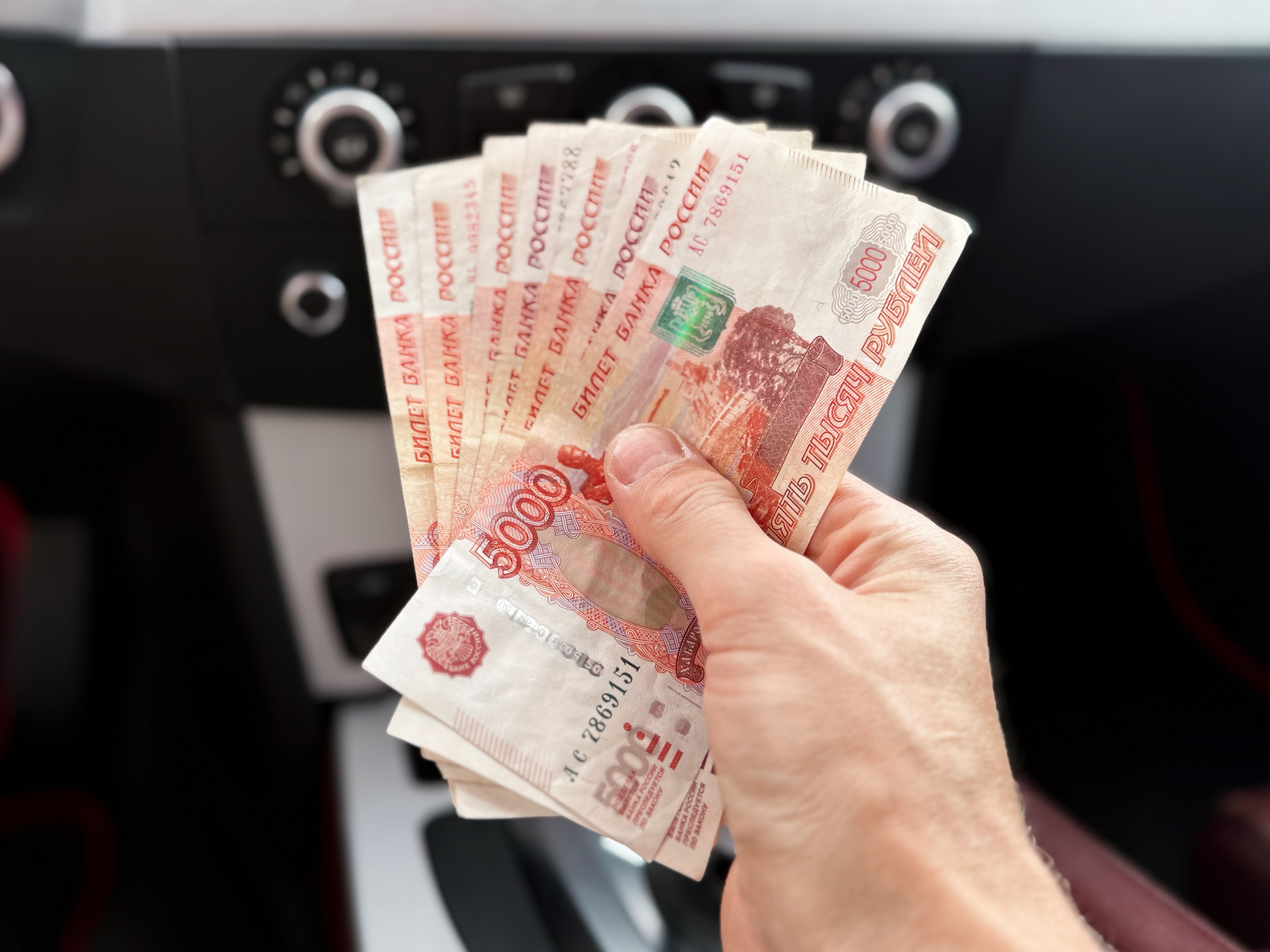 Man holding Russian currency