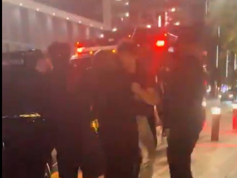 CLav being carried to a rescue vehicle