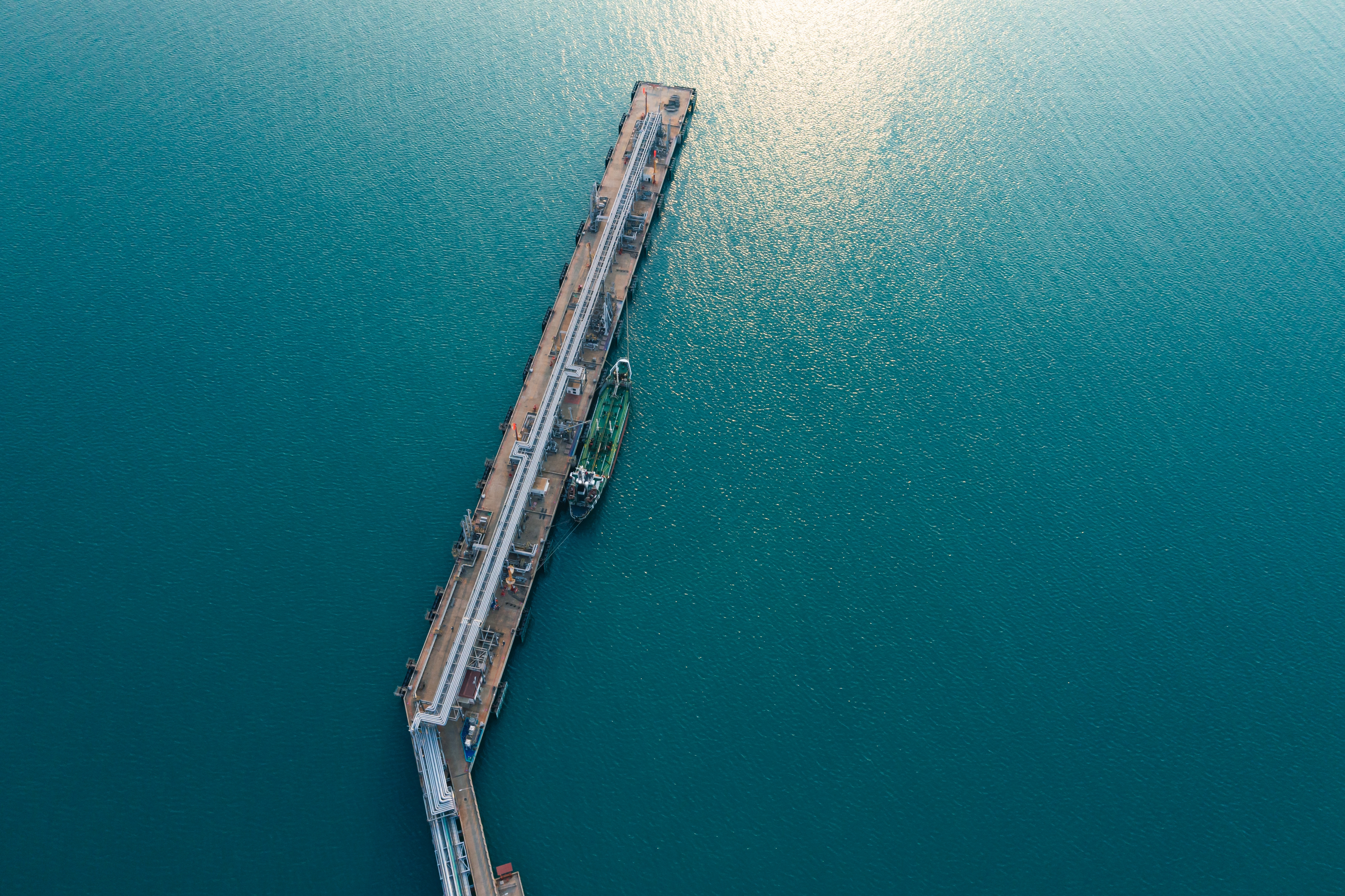 Aerial view of Modern logistic sea harbor with transshipment equipment for Crude oil tanker or Gas LPG tanker container ship.