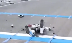 Humanoid robot fails to detect an obstacle and disintegrates on camera.