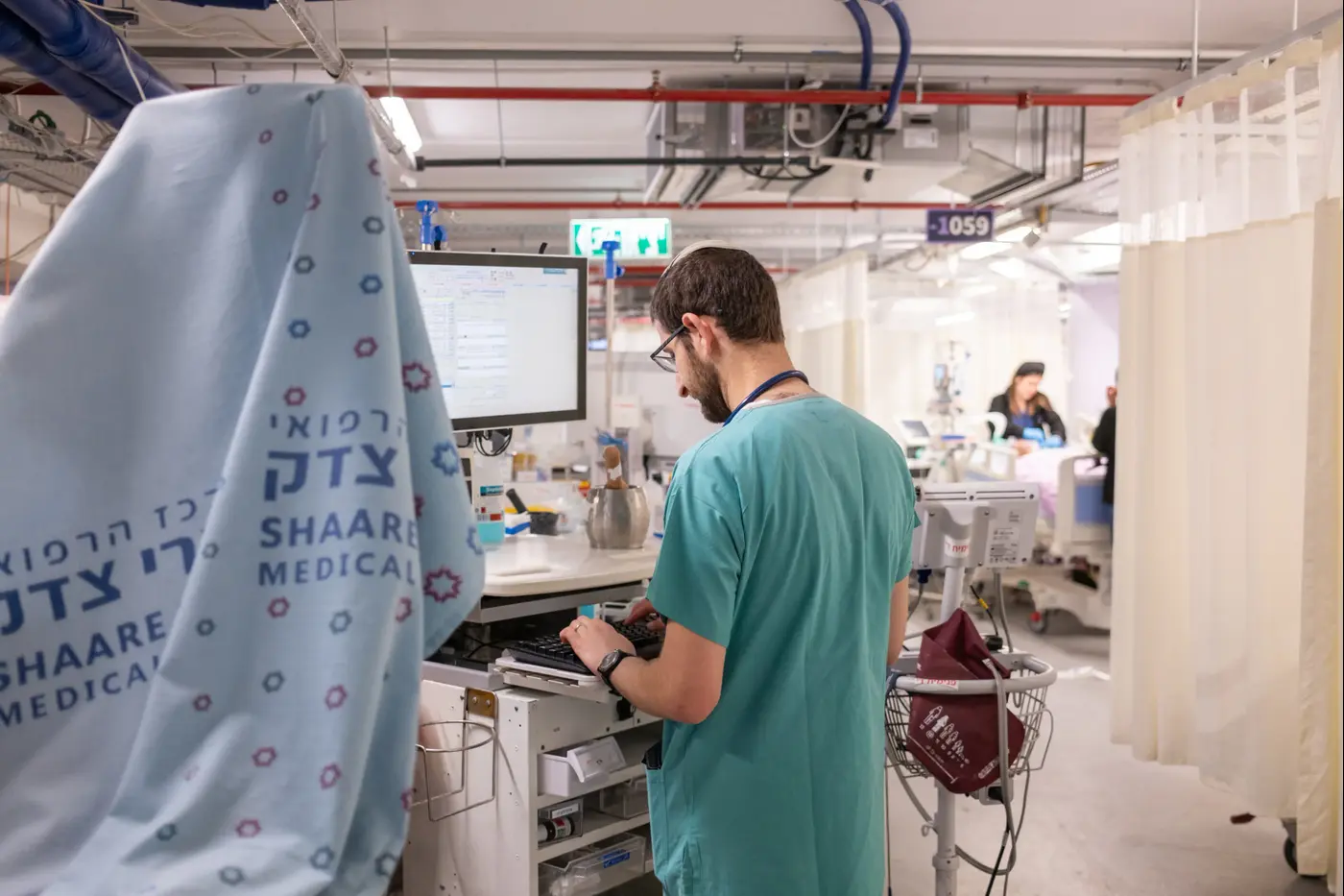 Doctors treating patients in hospital