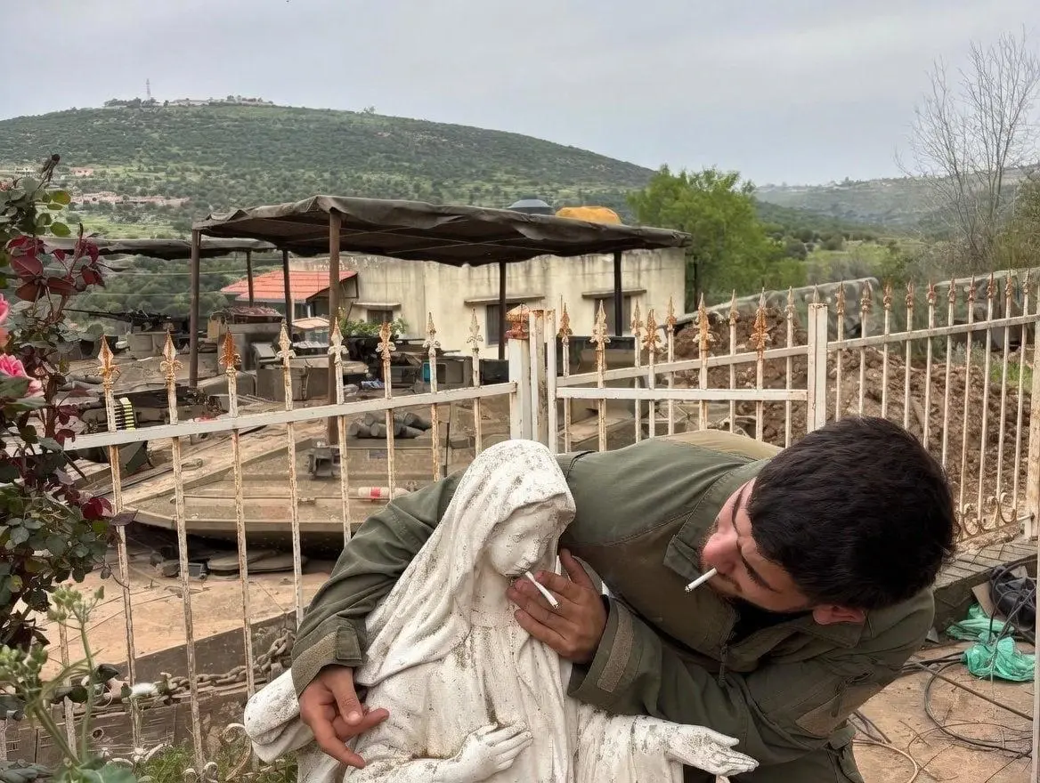 IDF soldier with Christian statue