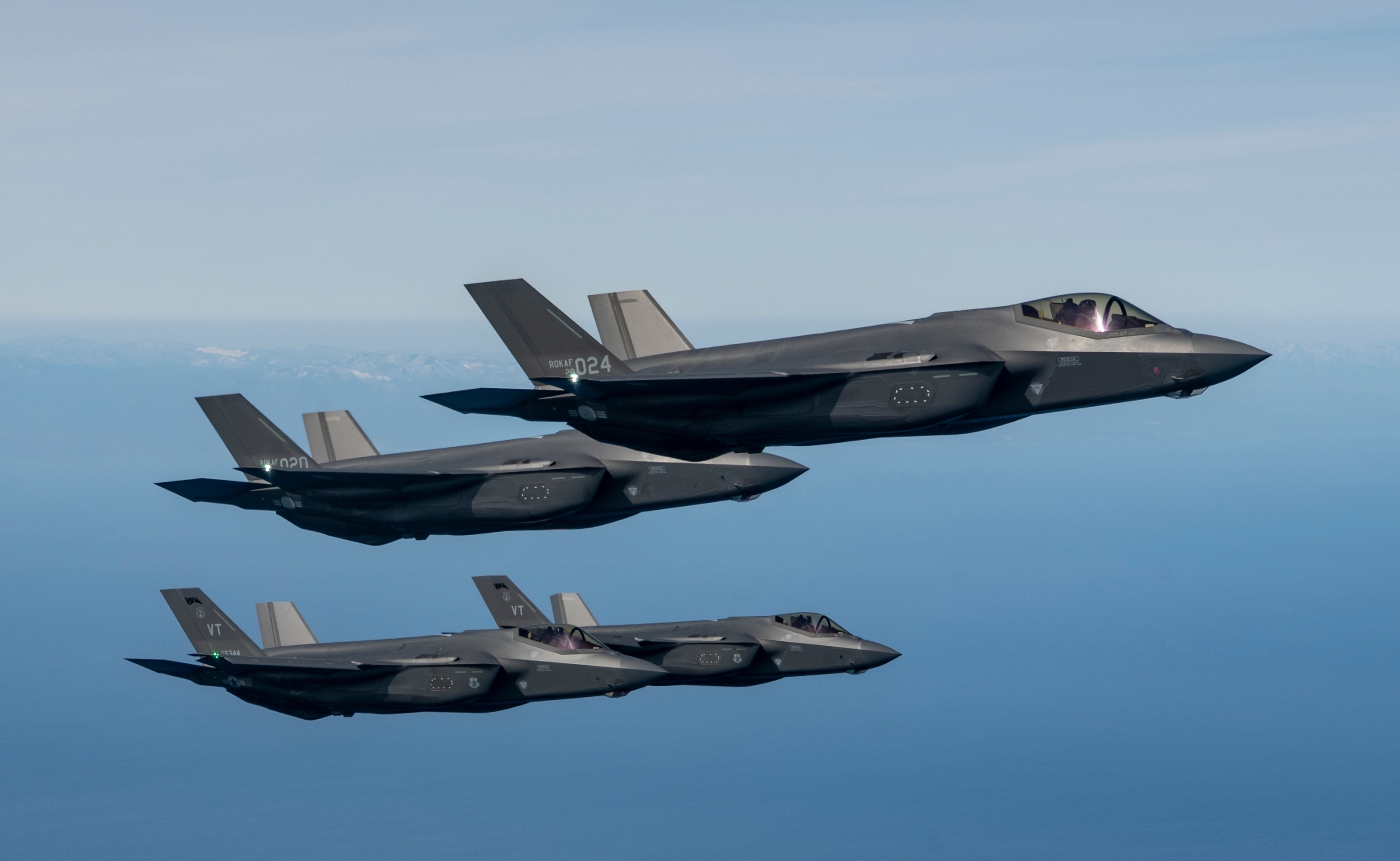 Two US Air Force F-35A Lightning IIs fly in formation with two ROKAF F-35As from Freedom Shield March 25, 2025