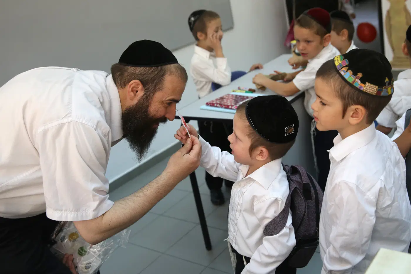 A teacher encouraging his students.