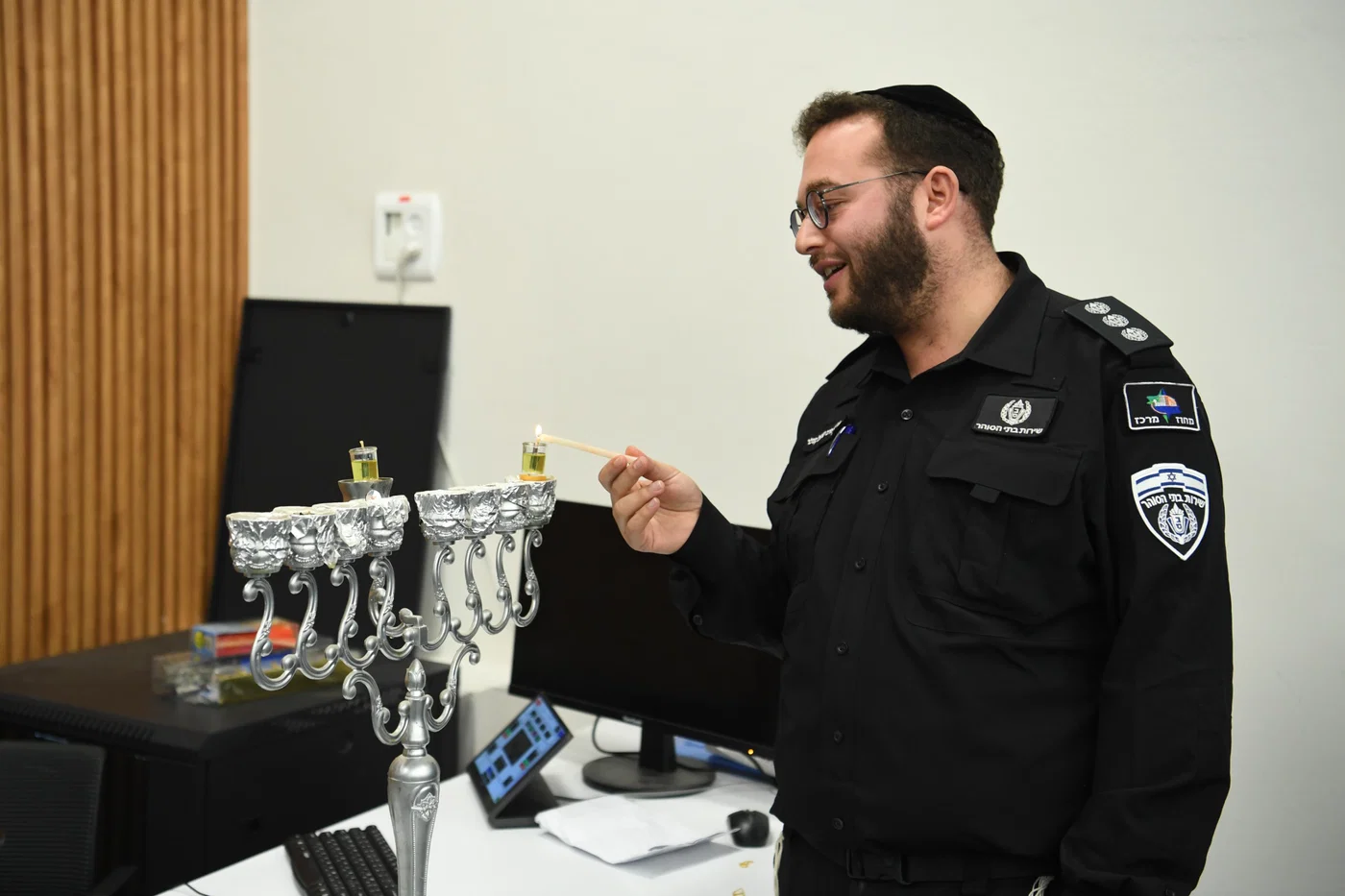 Lighting Chanukah candles in Ofer prison
