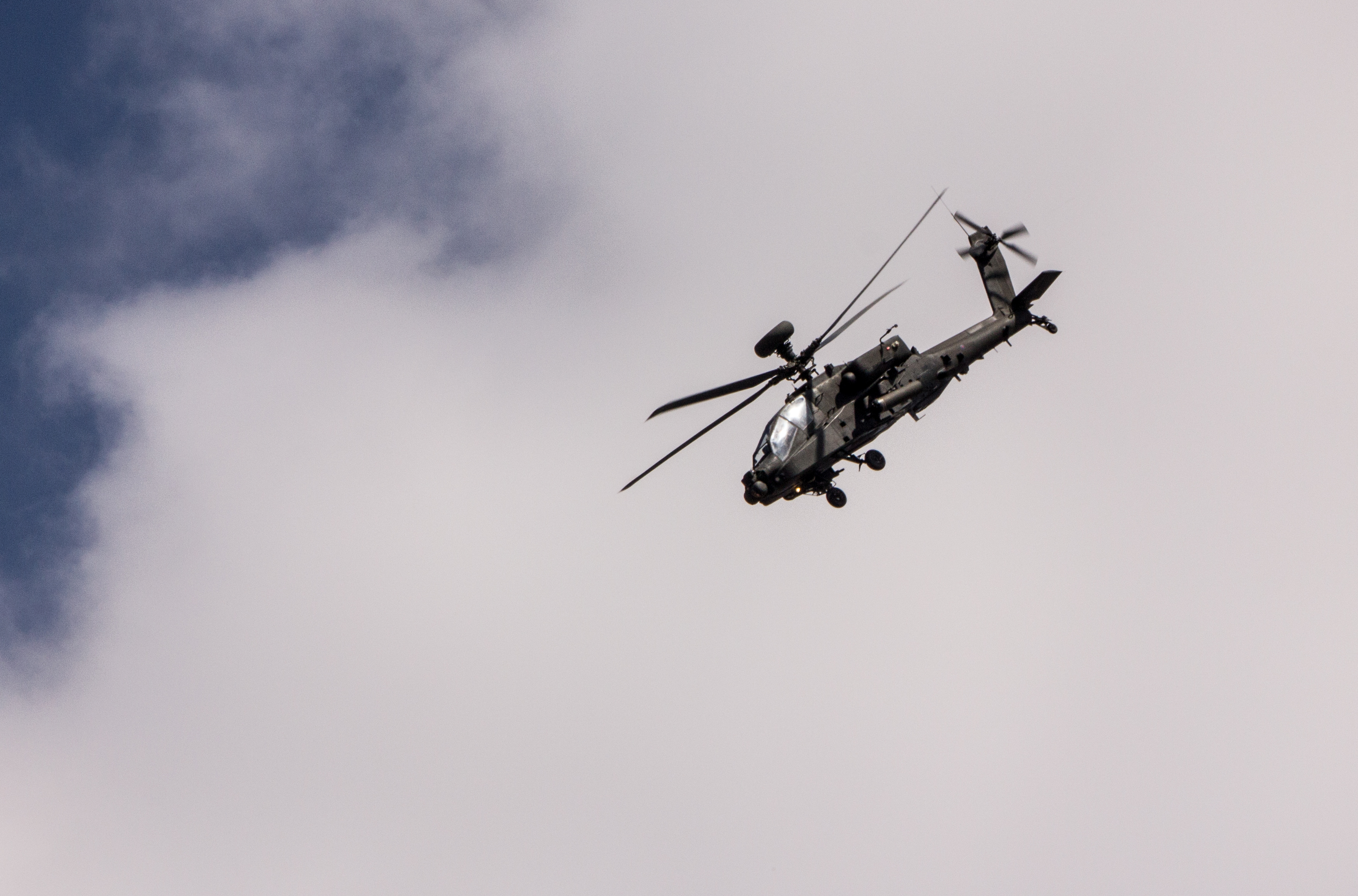 Apache helicopter flies