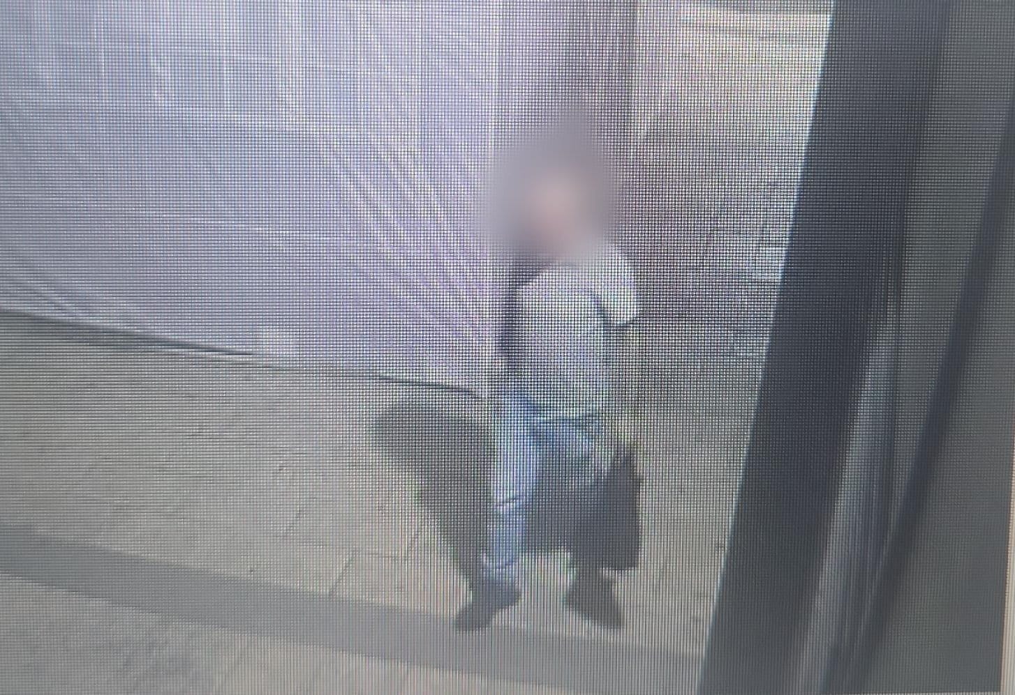 The suspect under arrest