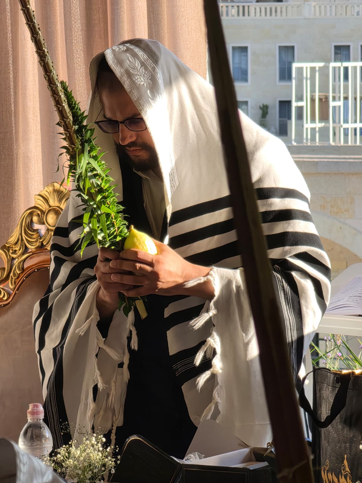 The Yanuka with the lulav this morning in his sukkah in Jerusalem
