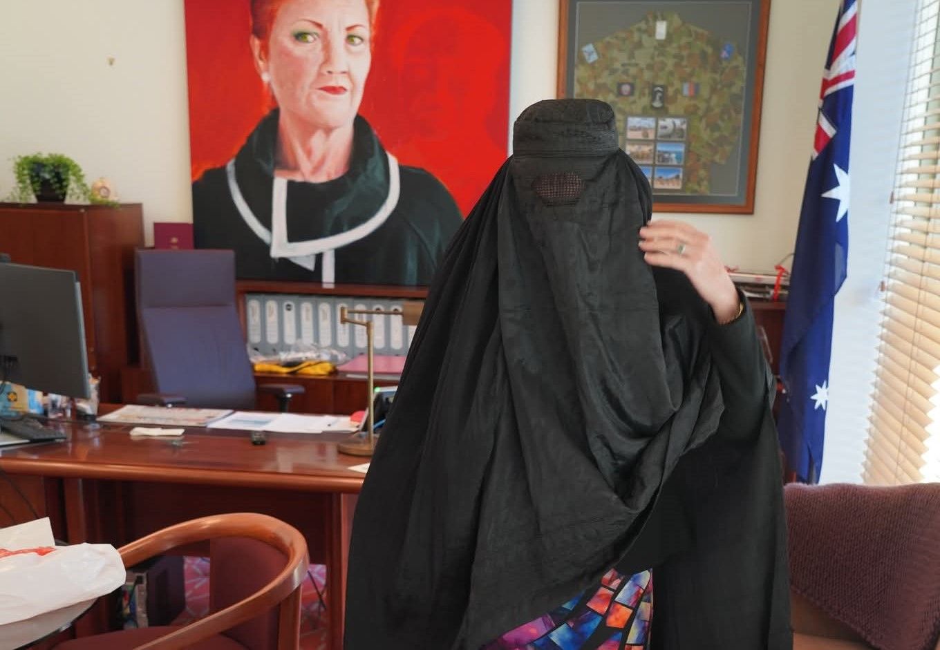 Parliamentarian wearing burqa in her office