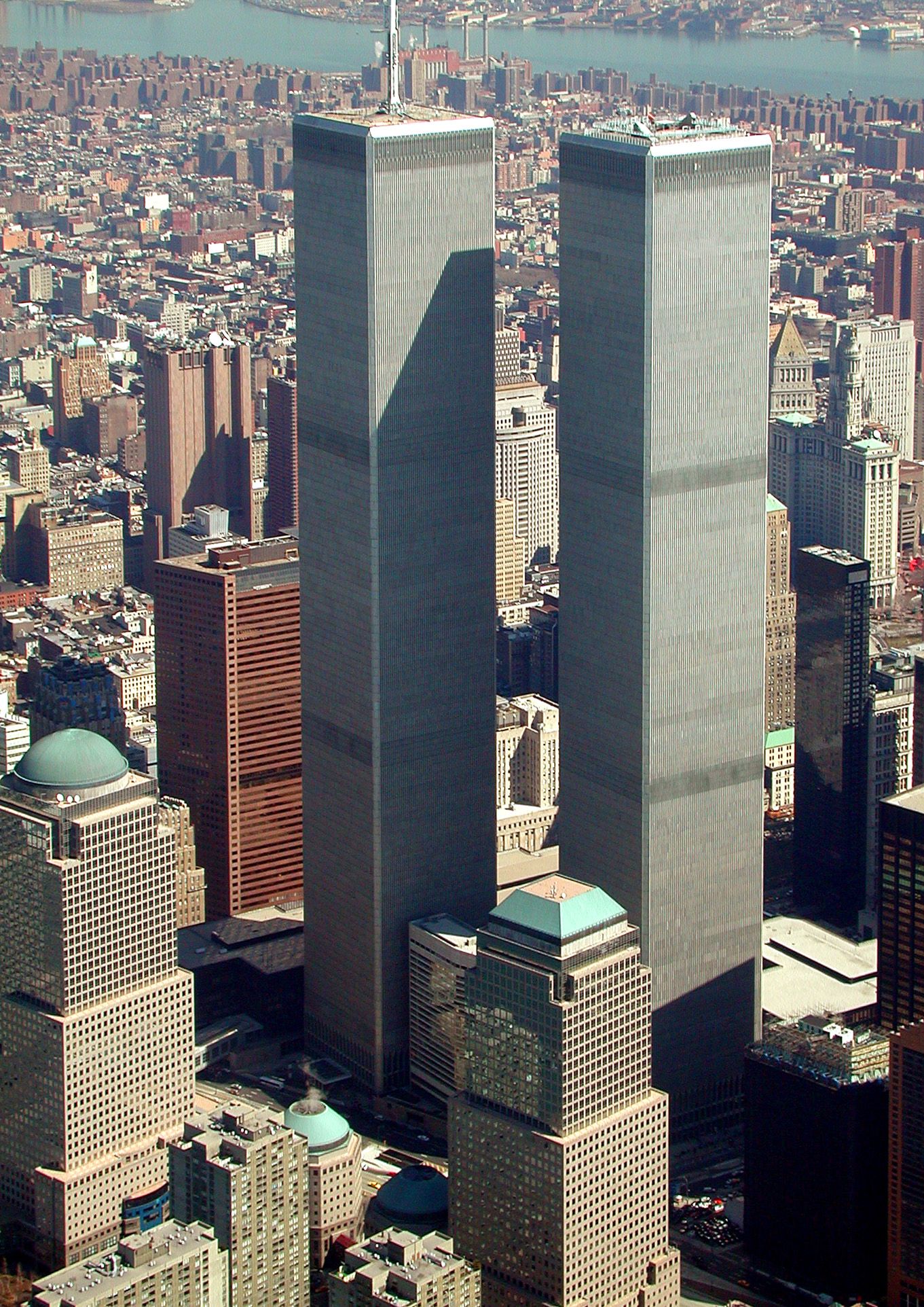 The North Tower — the building with the antenna on the left, where Cantor Fitzgerald's offices were located
