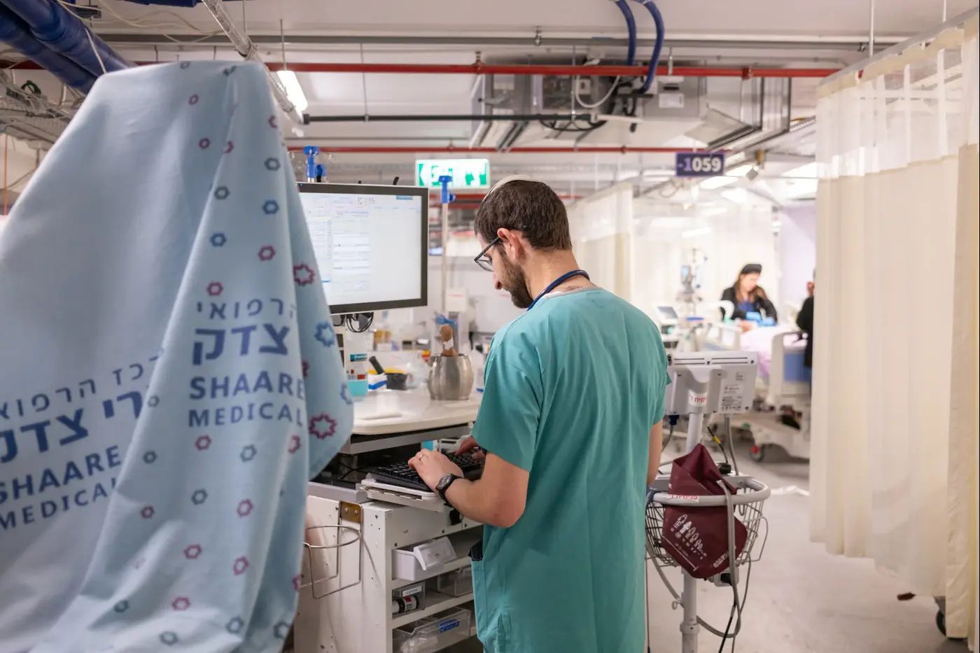 Doctors treating patients in hospital