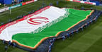 Iranian team unfurls the flag before the match
