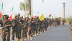 Houthis holding Iranian flag