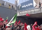 Enraged Crowd Tears Down Trump Billboard at Khamenei Funeral