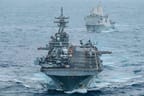 USS Boxer (LHD 4) and USS Portland (LPD 27) sail in formation while transiting the Indian Ocean,