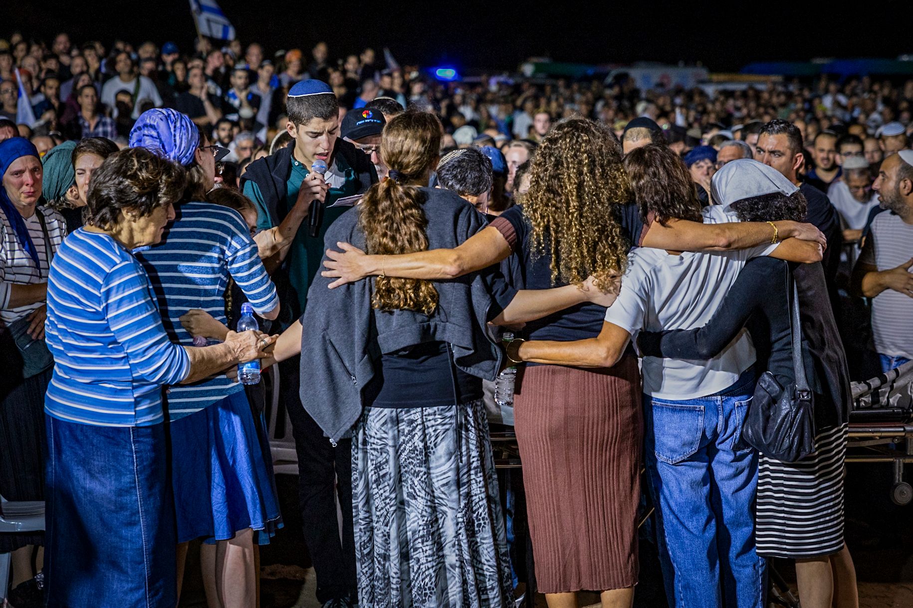 Family embrace at Netanel's funeral