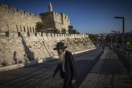 Religious man walks in Jerusalem, July 30, 2026
