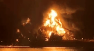 Explosion of a tanker in the Strait of Hormuz reportedly caused by Iranian mines, illustration