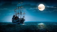 Pirate ship against a full moon