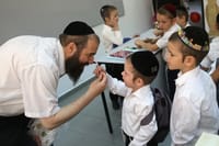 A teacher encouraging his students.