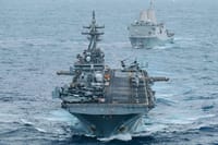 USS Boxer (LHD 4) and USS Portland (LPD 27) sail in formation while transiting the Indian Ocean,