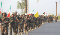 Houthi soldiers holding Iranian and Hezbollah flags