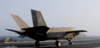 A U.S. Marine Corps F-35C stealth fighter jet launches from USS Abraham Lincoln (CVN 72
