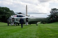 President Donald Trump beside Marine One Helicopter