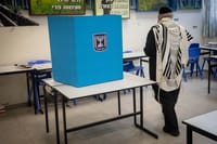 Haredi Man Praying Near An Election ballot