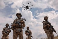 Uk soldiers with drone above them