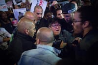 Sheffi Paz protesting and being arrested