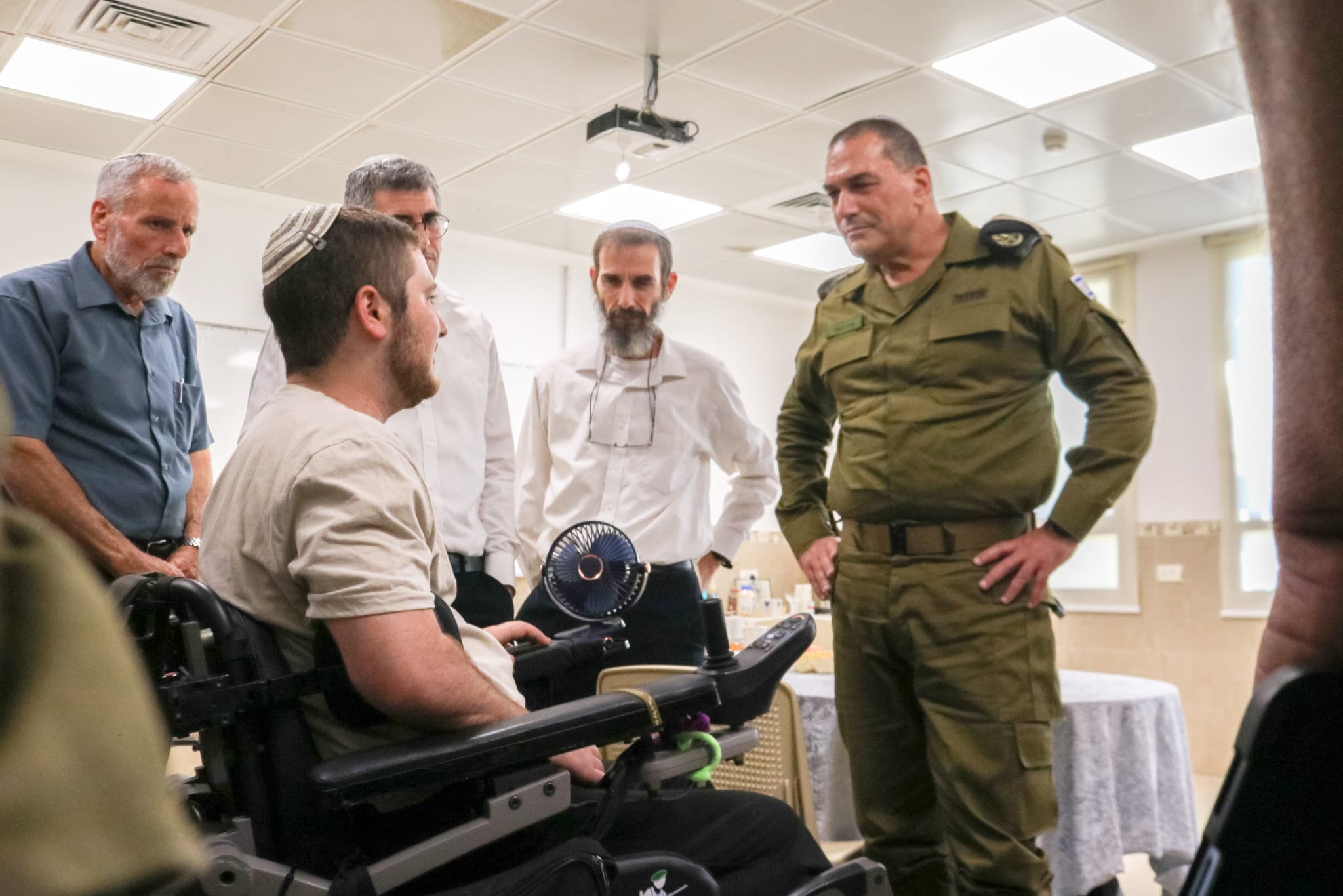 The Chief of General Staff with the wounded of the war