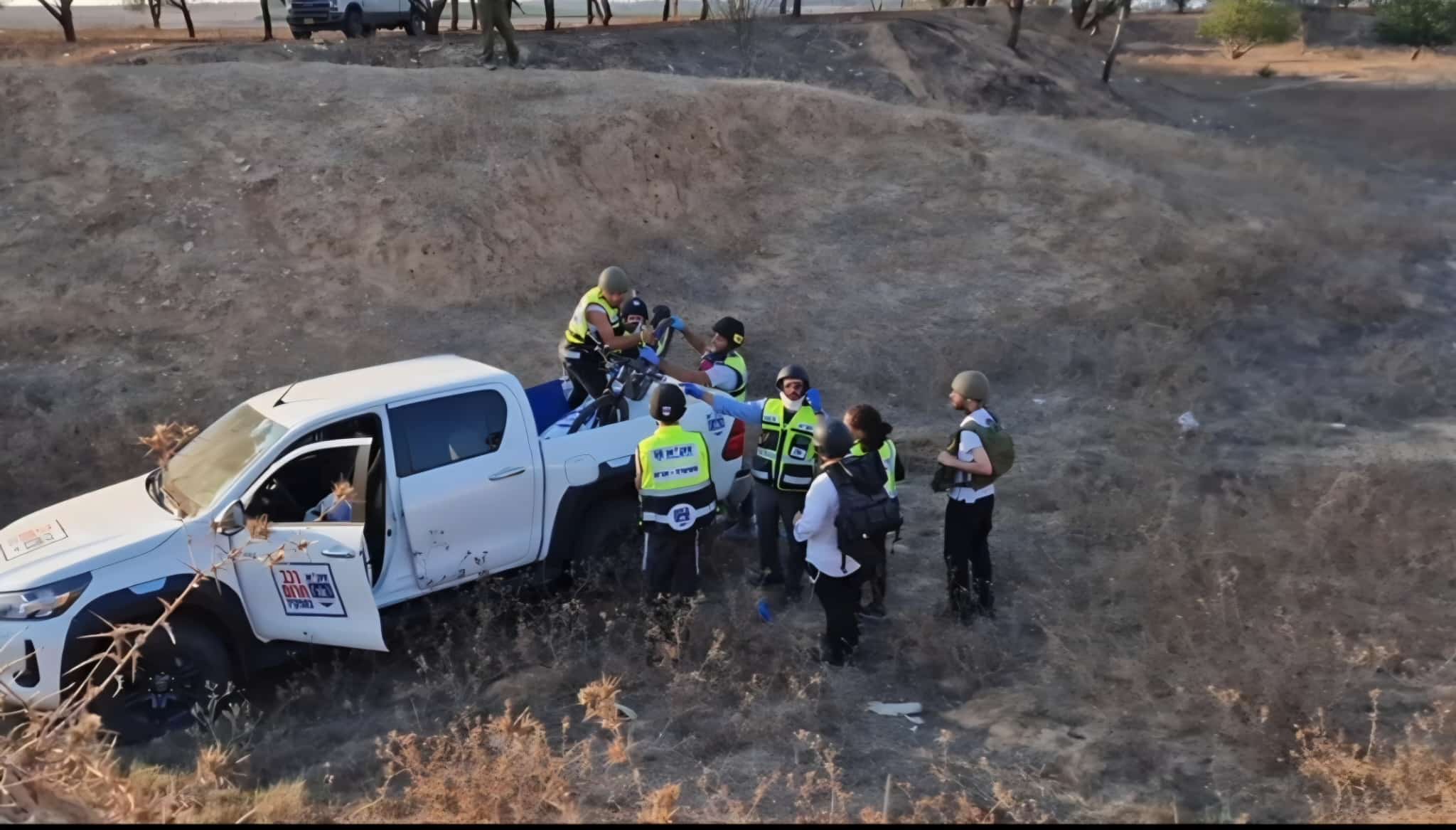 Loading bodies onto the vehicle | Photo: ZAKA
