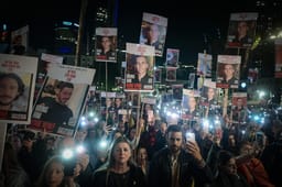 People attend a rally calling for the release of Israelis held kidnapped by Hamas terrorists in Gaza at "Hostage Square" in Tel Aviv, December 30, 2023.